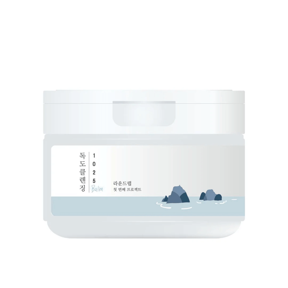 Zaprt bel lonček 1025 Dokdo Cleansing Balm z minimalistično morsko temo na etiketi, na beli podlagi.
