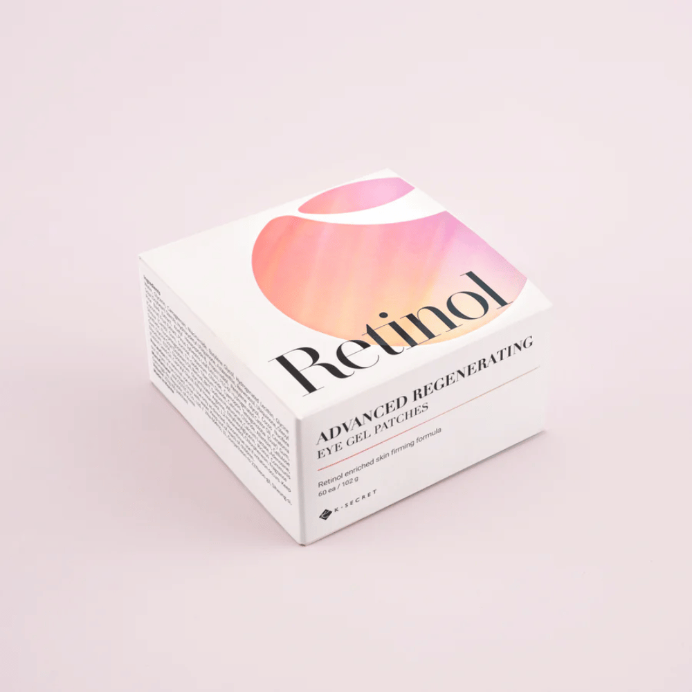 Embalaža K-Secret Advanced Regenerating Eye Gel Patches z retinolom v beli in rožnati zasnovi.