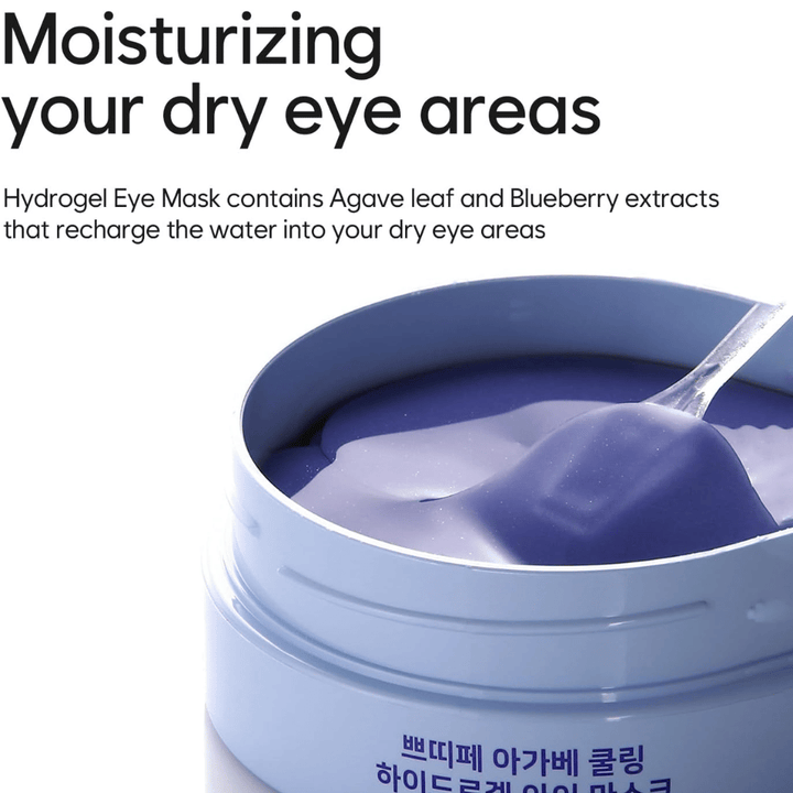 Slika izdelka Agave Cooling Hydrogel Eye Mask s poudarkom na vlaženju suhih predelov okoli oči. Slika prikazuje hidrogelno formulo in priloženo spatulo.