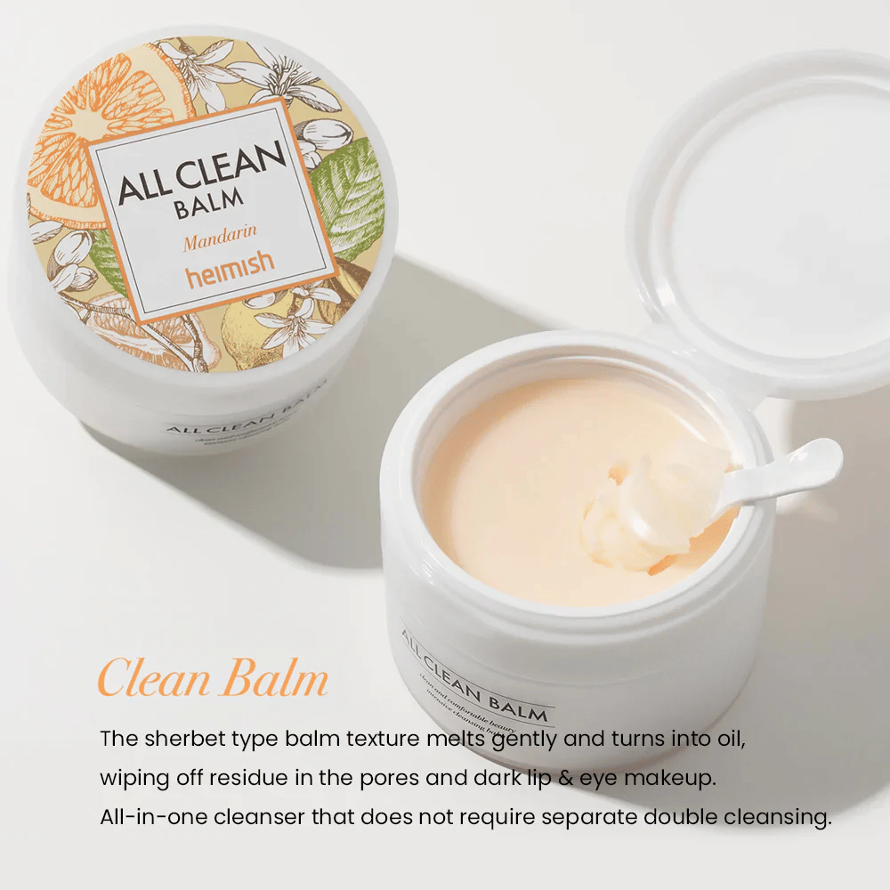Odprt kozarec Heimish All Clean Balm Mandarin z žlico, ki meša kremni čistilni balzam, z barvito etiketo in napisom 'Clean Balm' v ospredju.
