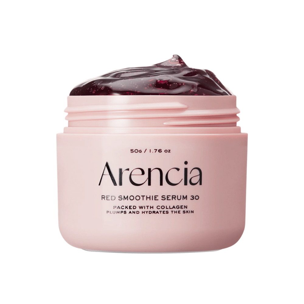Povečava na Arencia Red Smoothie Serum 30 v roza lončku, napolnjenem z globoko rdečim gelom za vlaženje in čvrstost.