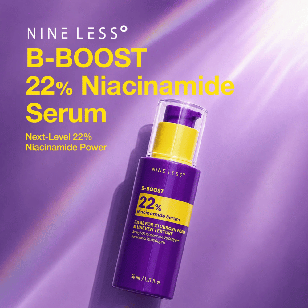 6. NINE LESS B-Boost 22% Niacinamide Serum – vijolična steklenička seruma z rumeno etiketo proti vidnim poram