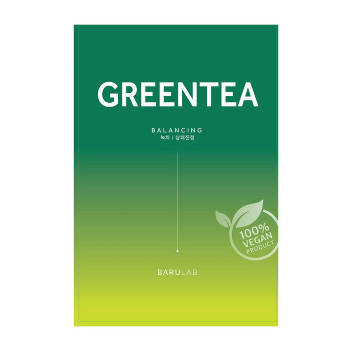 Embalaža BARULAB "GREENTEA Balancing" maske, označena kot "100% Vegan Product". Embalaža ima barvni prehod iz temno zelene v svetlo rumeno.