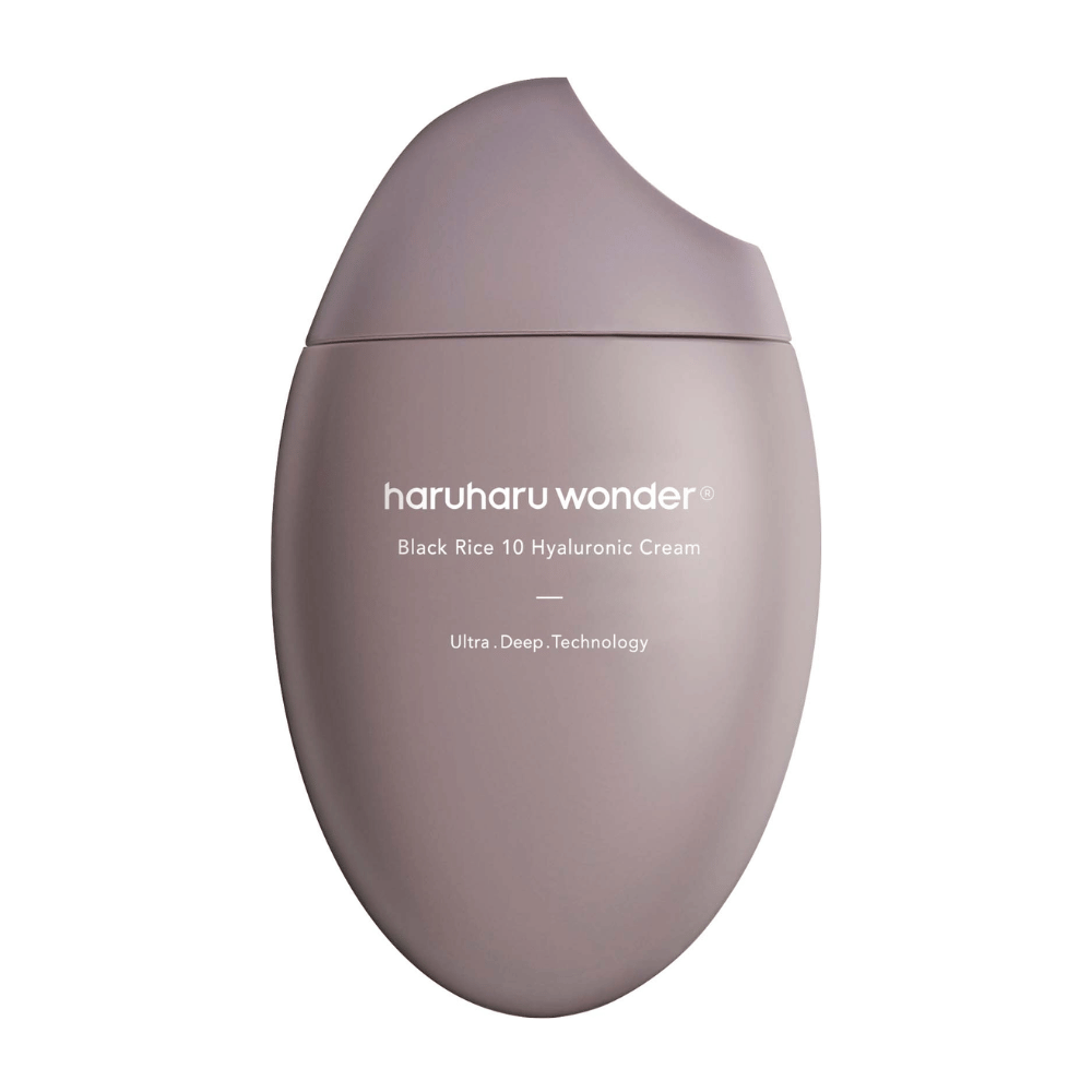 Gladek in eleganten paket "Haruharu Wonder Black Rice 10 Hyaluronic Cream" z belim besedilom. Embalaža uporablja "Ultra Deep Technology", kar nakazuje napredno formulo za globinsko vlaženje kože.