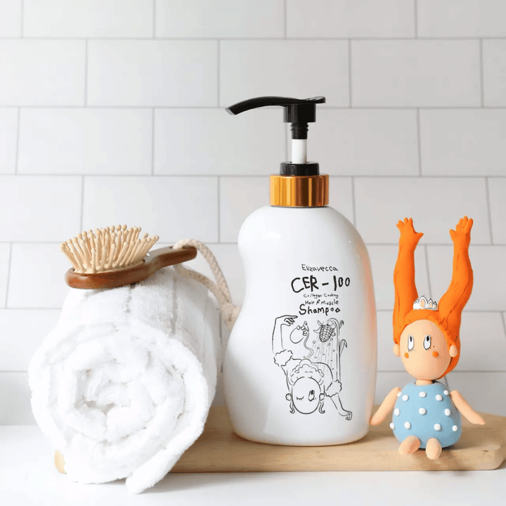 Elizavecca CER-100 Collagen Coating Hair A+ Muscle Shampoo – krepilni kolagenski šampon za suhe in poškodovane lase v kopalniškem okolju