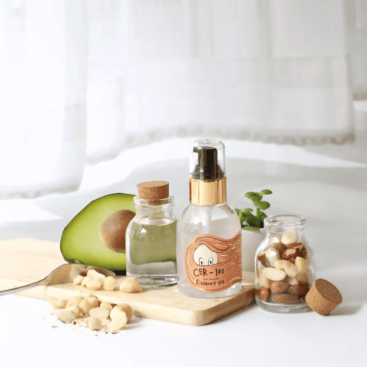 Elizavecca CER-100 Hair Muscle Essence Oil – korejsko olje za lase z avokadom in naravnimi olji, ki pomaga vlažiti, krepiti in daje sijaj suhim in poškodovanim lasem.