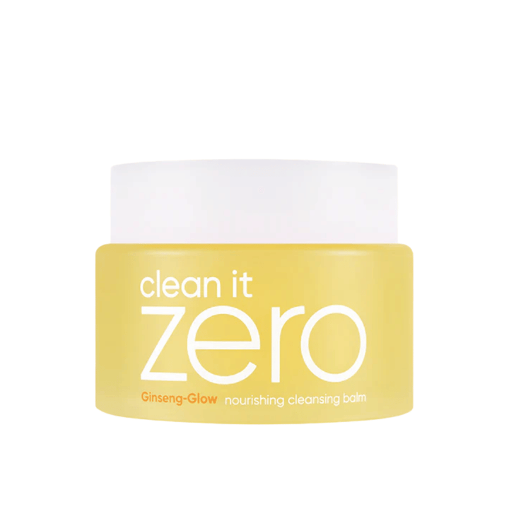 Clean It Zero Ginseng-Glow Nourishing Cleansing Balm v rumeni posodi na beli podlagi, vlažilni čistilni balzam od BANILA CO, ki učinkovito odstranjuje ličila in nečistoče.