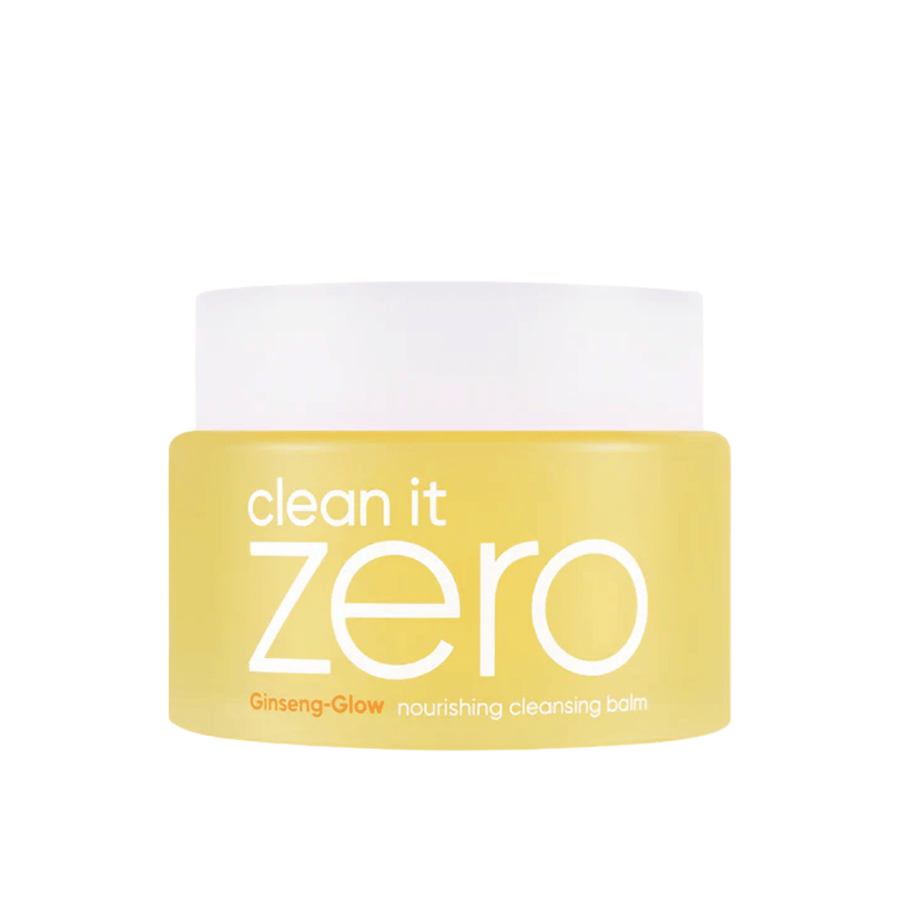 Clean It Zero Ginseng-Glow Nourishing Cleansing Balm v rumeni posodi na beli podlagi, vlažilni čistilni balzam od BANILA CO, ki učinkovito odstranjuje ličila in nečistoče.