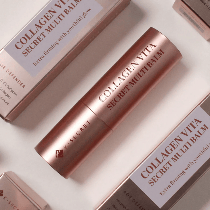 K-Secret Collagen Vita Secret Multi Balm z embalažami v ozadju, besedilo ”Extra firming with youthful glow”.