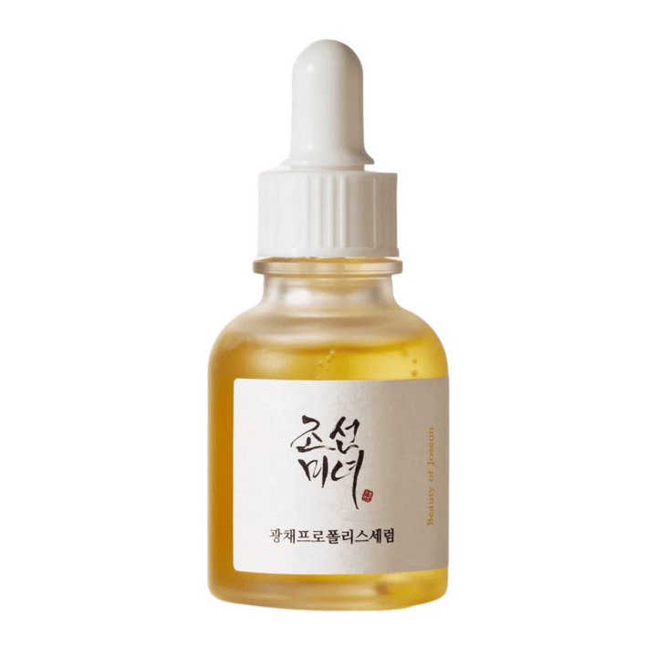 Steklenička Beauty of Joseon Glow Serum z belo pipeto in zlatim serumom, svetleči izdelek s propolisom in niacinamidom.