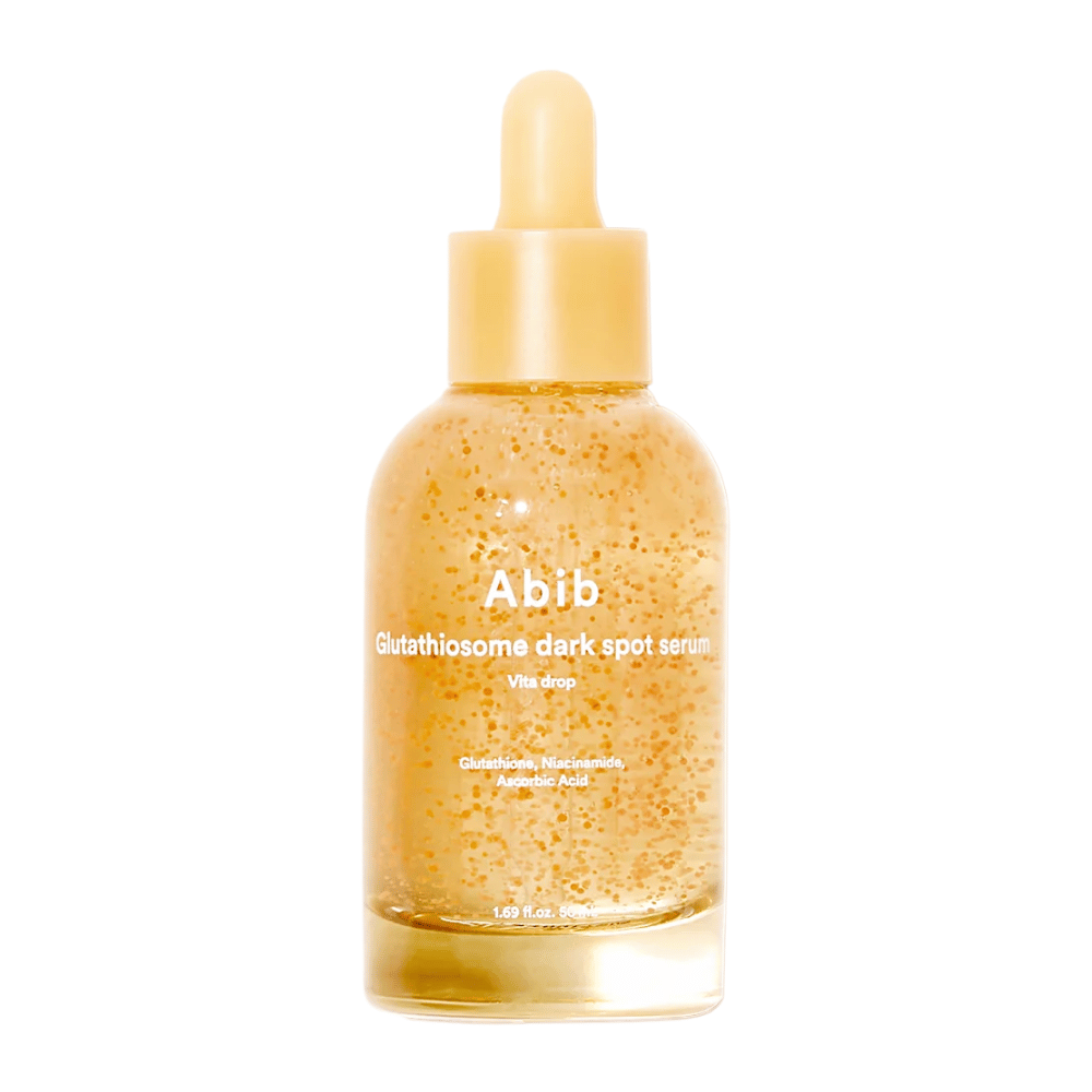 Slika izdelka Abib Glutathiosome Dark Spot Serum Vita Drop v prozorni steklenički z rumeno pipeto in vidnimi mikrokapsulami v serumu.