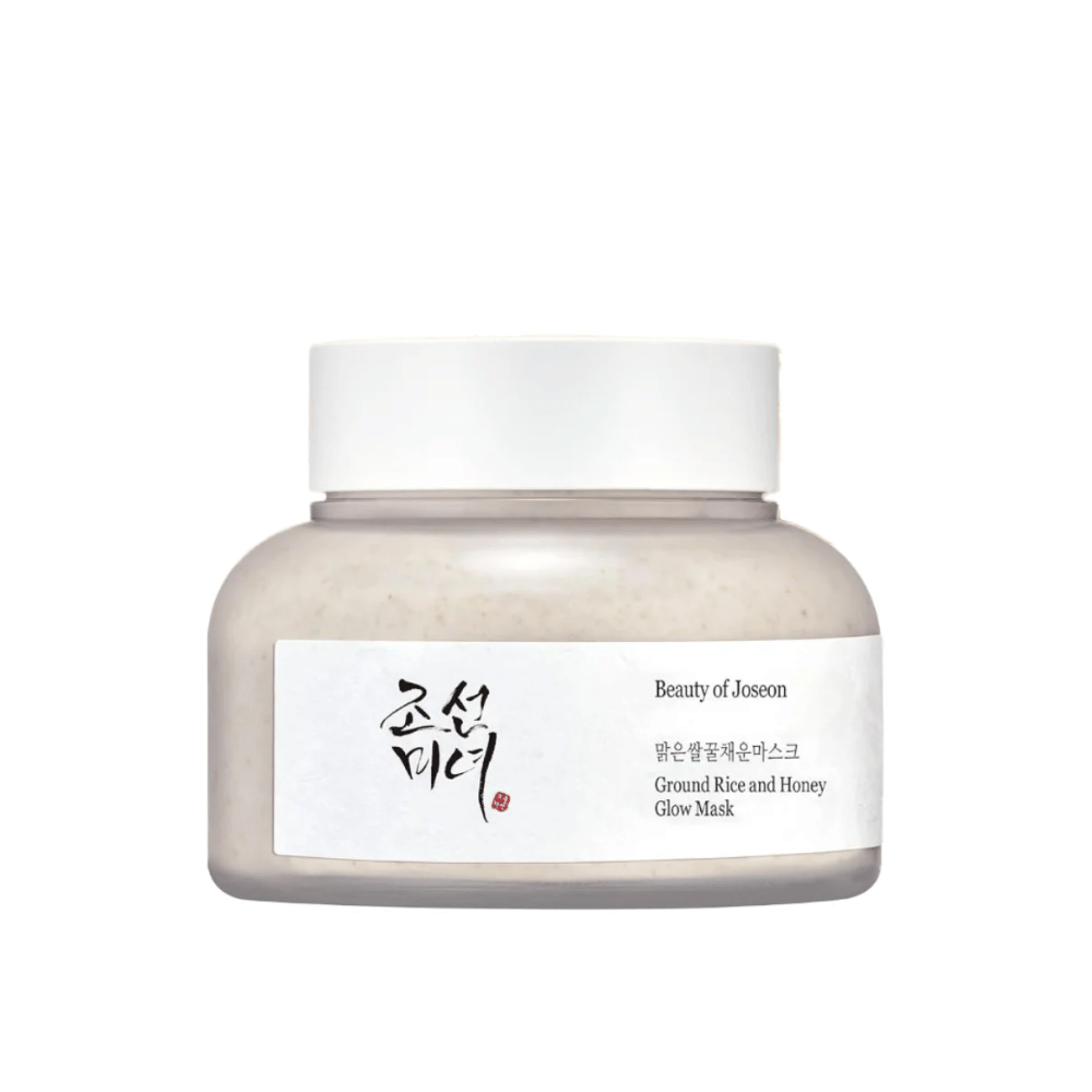Kozarec "Beauty of Joseon Ground Rice and Honey Glow Mask". Embalaža je preprosta z belim pokrovom in etiketo, ki predstavlja ime izdelka in sestavine v korejščini in angleščini. Izdelek je zasnovan za sijaj in nego kože.