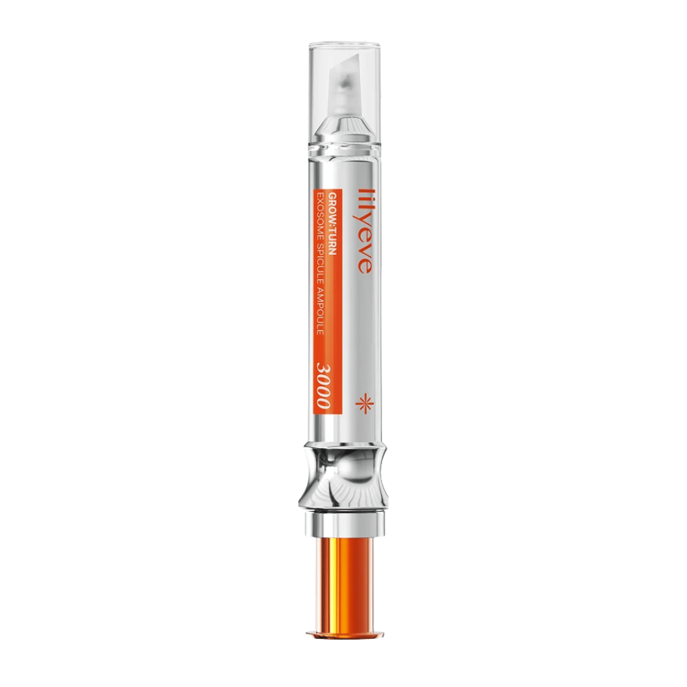 LILYEVE Grow Turn Exosome Spicule Ampoule 3000 – ampula za lasišče z natančnim aplikatorjem v srebrni in oranžni embalaži.