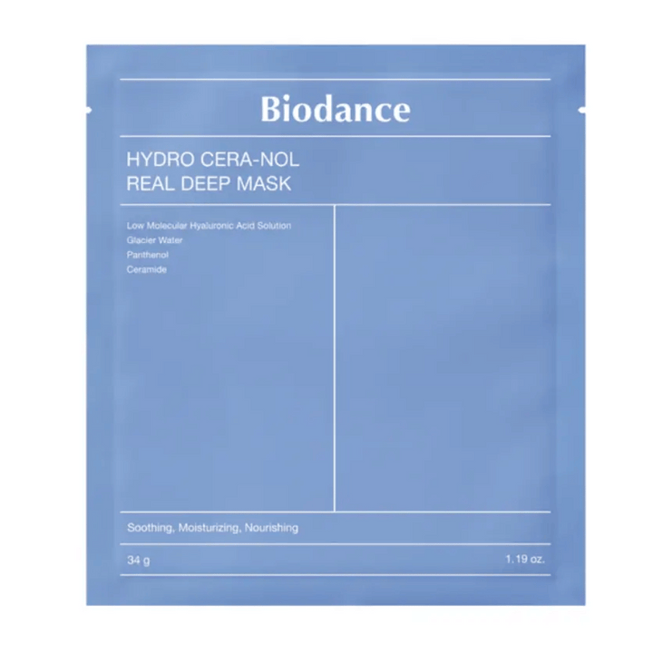 Embalaža prikazuje "Biodance Hydro Cera-Nol Real Deep Mask". Gre za pomirjujočo, vlažilno in hranilno obrazno masko, ki vsebuje nizkomolekularno hialuronsko kislino, ledeniško vodo, pantenol in ceramide. Dizajn je preprost v pomirjujočem modrem tonu.