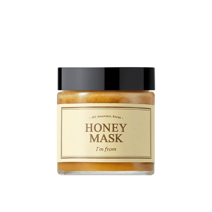 Ena posoda "I'm from Honey Mask", z naravno vsebnostjo medu, na beli podlagi.