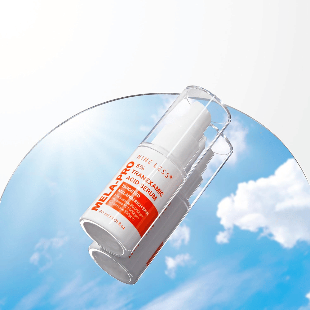 NINE LESS MELA-PRO 5% Tranexamic Acid Serum 30 ml s pumpico, serum za pigmentacijo in temne madeže.