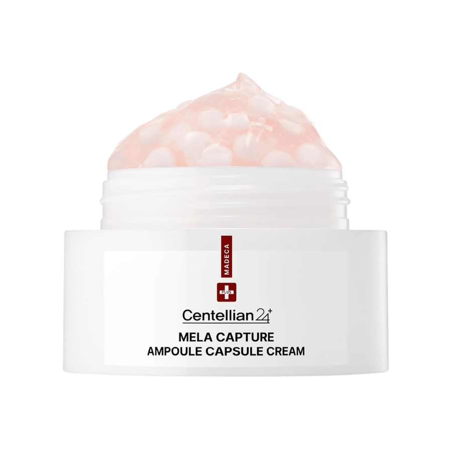 Bližnji posnetek Centellian24 Madeca Mela Capture Ampoule Capsule Cream, ki prikazuje rožnato gel kremo z inkapsuliranimi ampulnimi kroglicami v lončku.