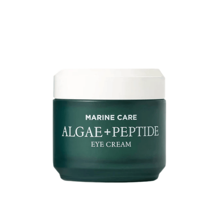 Heimish Marine Care Algae + Peptide Eye Cream v temnozeleni posodi z belim pokrovom. Krema za oči, obogatena z algami in peptidi za vlaženje, posvetlitev in zmanjšanje drobnih linij okoli oči.