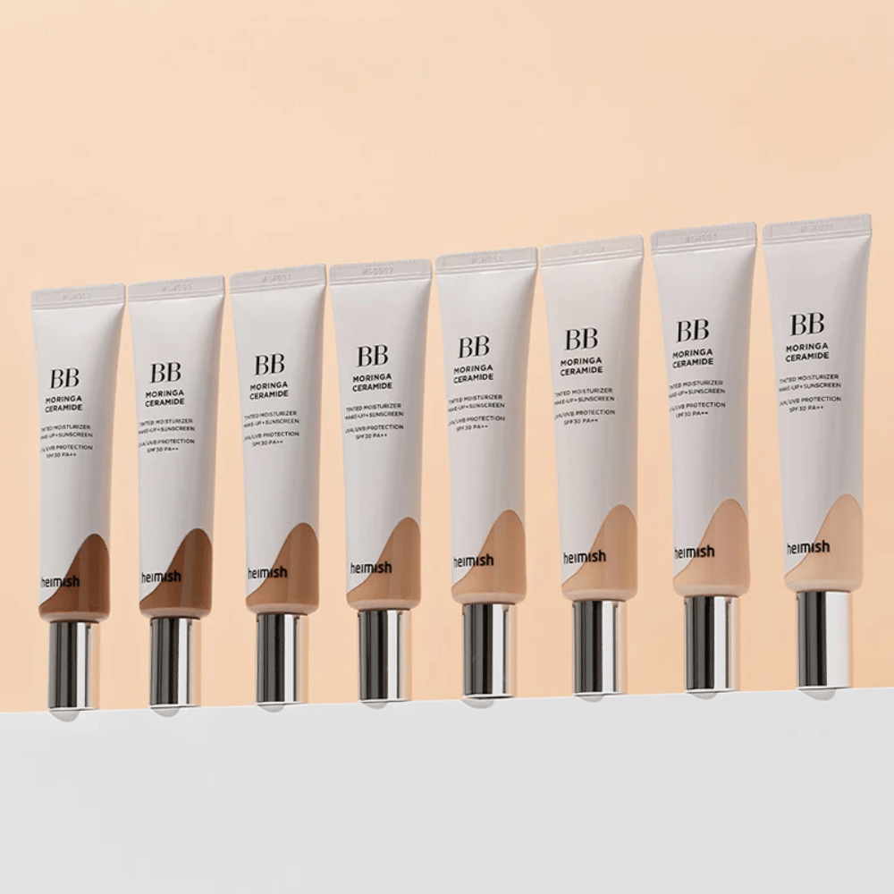 Vrsta Heimish Moringa Ceramide BB Cream v več barvnih odtenkih. Slika prikazuje razpon od svetlejših do temnejših tonik za obraz, da ustreza različnim tonom kože in potrebam.