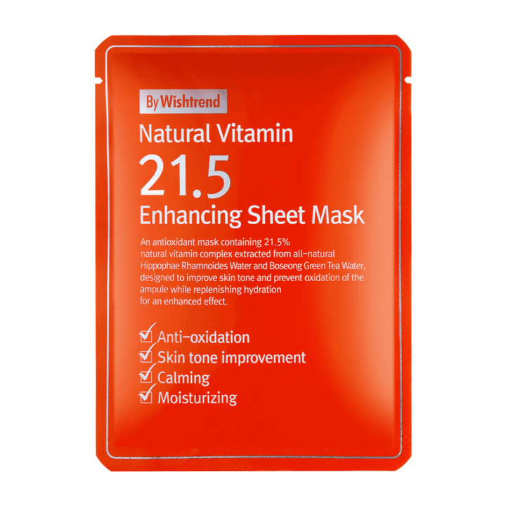 By Wishtrend Natural Vitamin 21.5% Enhancing Sheet Mask v rdeči embalaži z belim besedilom, ki poudarja njene antioksidativne in vlažilne lastnosti.