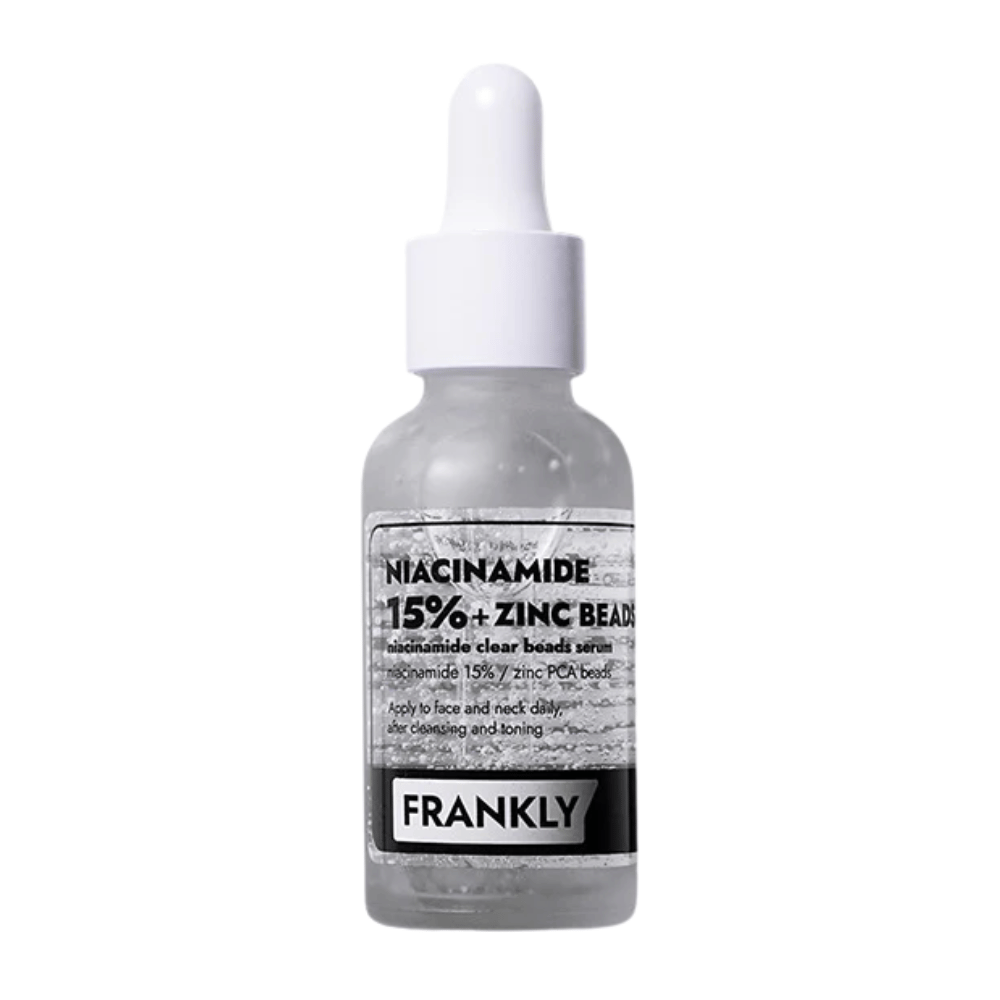 Slika izdelka FRANKLY Niacinamide 15% + Zinc Beads Serum v steklenički s pipeto. Serum, ki uravnava, pomirja in izboljšuje jasnost kože.