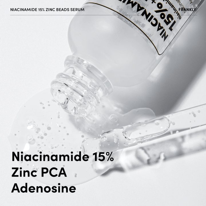 Povečana slika FRANKLY Niacinamide 15% + Zinc Beads Serum, ki se izliva. Besedilo prikazuje sestavine: Niacinamid 15 %, Zinc PCA in Adenosin.