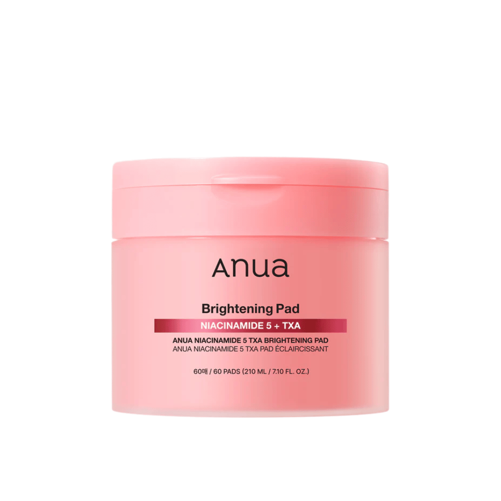 Roza embalaža Anua Brightening Pad z napisom "Niacinamide 5 + TXA", vsebuje 60 blazinic za nego kože s poudarkom na sijaju in enakomernejšem tenu kože.
