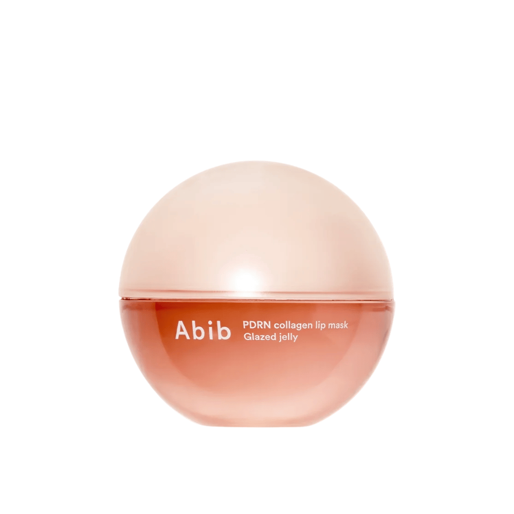 Roza okrogla posoda z napisom "Abib PDRN Collagen Lip Mask Glazed Jelly" na sprednji strani, fotografirana na beli podlagi.