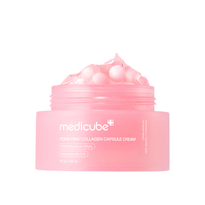 Slika izdelka Medicube PDRN Pink Collagen Capsule Cream z vidnimi roza kapsulami v prozorni roza posodi, zasnovani za vlaženje in izenačevanje tena kože.