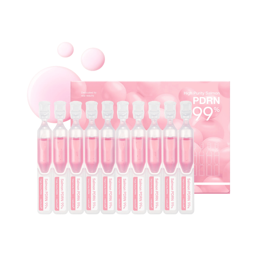 Medicube PDRN Pink One Day Serum Set z desetimi posameznimi ampule za obraz in embalažo izdelka. Set vsebuje serum z 99 % visoko prečiščenim lososovim PDRN za vlaženje, sijaj in vsakodnevno nego kože.