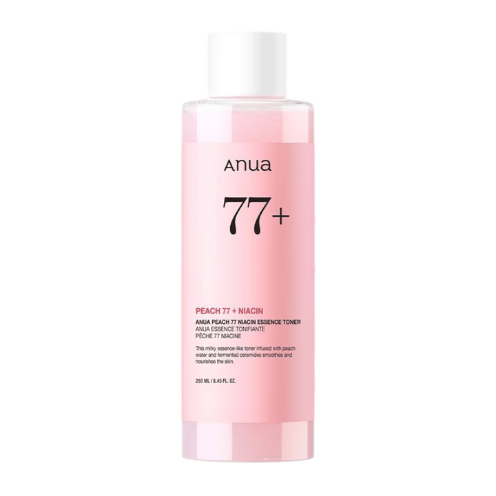 Anua Peach 77 Niacin Essence Toner v prozorni roza steklenici z belim pokrovčkom, ki vsebuje 250 ml mlečnega tonika za enakomernejši ten kože in sijaj.
