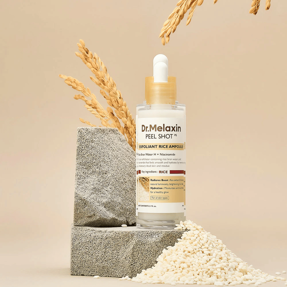Dr.Melaxin Peel Shot Exfoliant Rice Ampoule postavljena z rižem in kamnitimi bloki, korejska eksfoliantna ampula z izvlečkom riža in niacinamidom za jasnejšo in mehkejšo kožo.