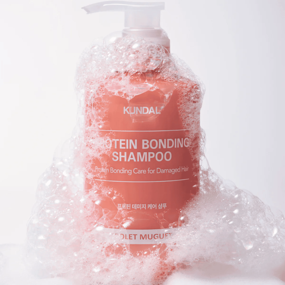 KUNDAL Protein Bonding Shampoo Violet Muguet prekrit z bogato peno, obnovitveni šampon za poškodovane lase.