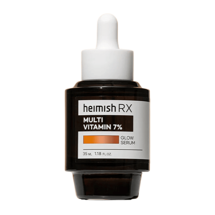 Heimish RX Multi Vitamin 7% Glow Serum v temni steklenički s pipetnim pokrovčkom, zasnovan za sijaj in nego kože.