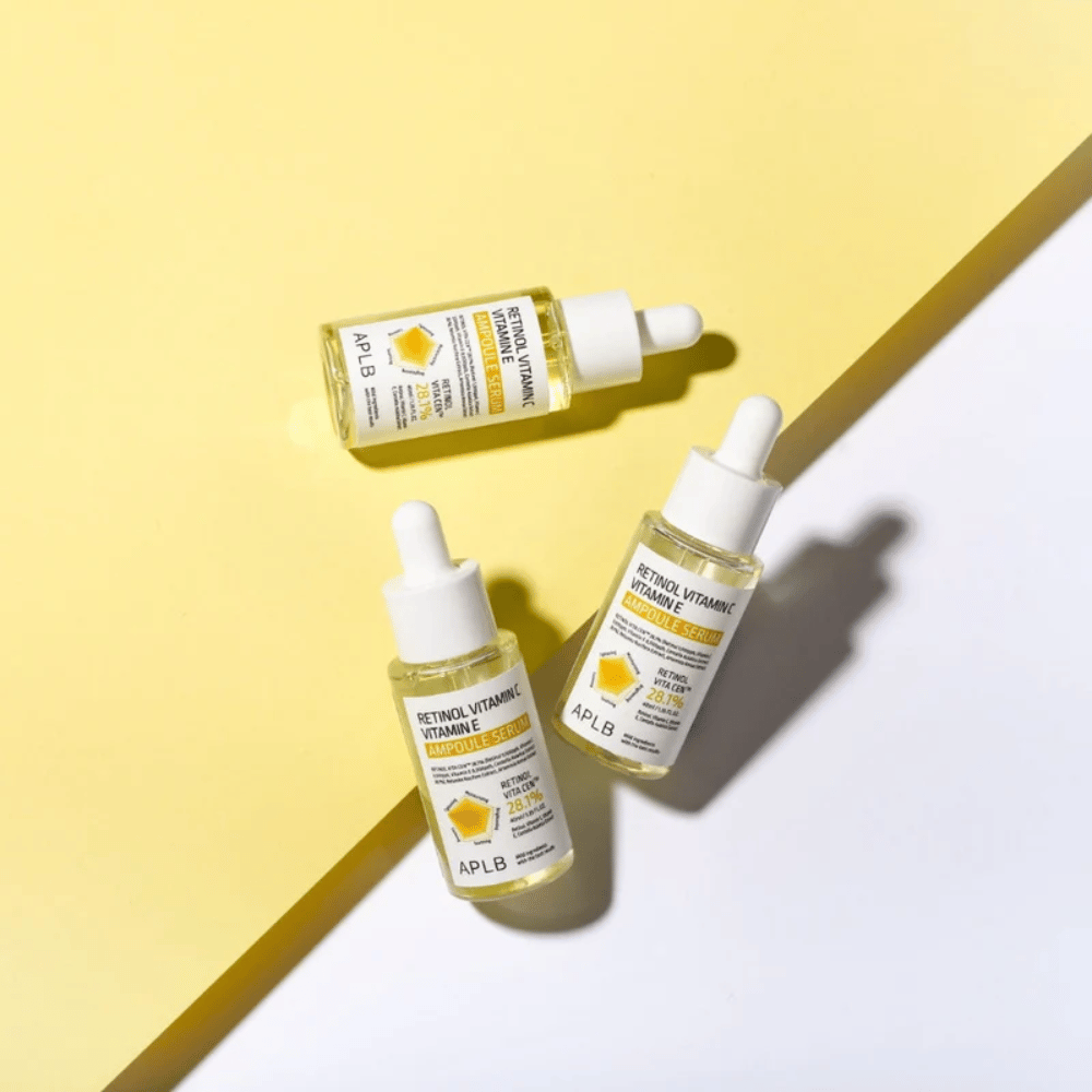 APLB Retinol Vitamin C Vitamin E Ampoule Serum na rumenem in belem ozadju