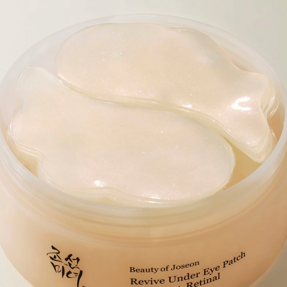 Pregledna slika Beauty of Joseon Revive Under Eye Patch v lončku z več gelnimi obliži, korejska nega oči za suhost, drobne linije in utrujeno kožo okoli oči.