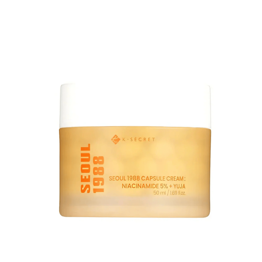 Posoda s K-Secret Seoul 1988 Capsule Cream Niacinamide 5% + Yuja, 50 ml, v zlato obarvani embalaži.