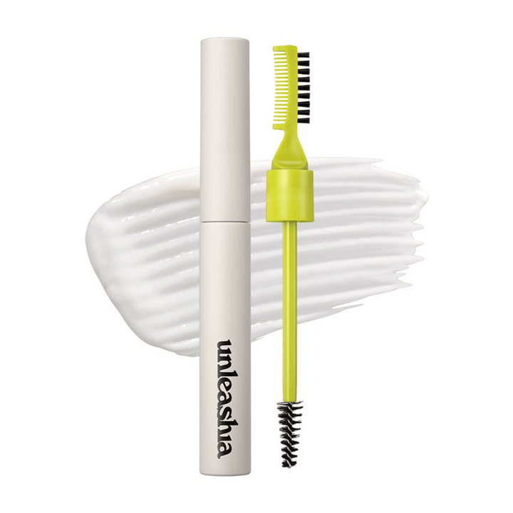 Puder za obrvi "unleashia" z aplikatorjem, zelenim glavnikom in črno krtačo na beli, valoviti podlagi.