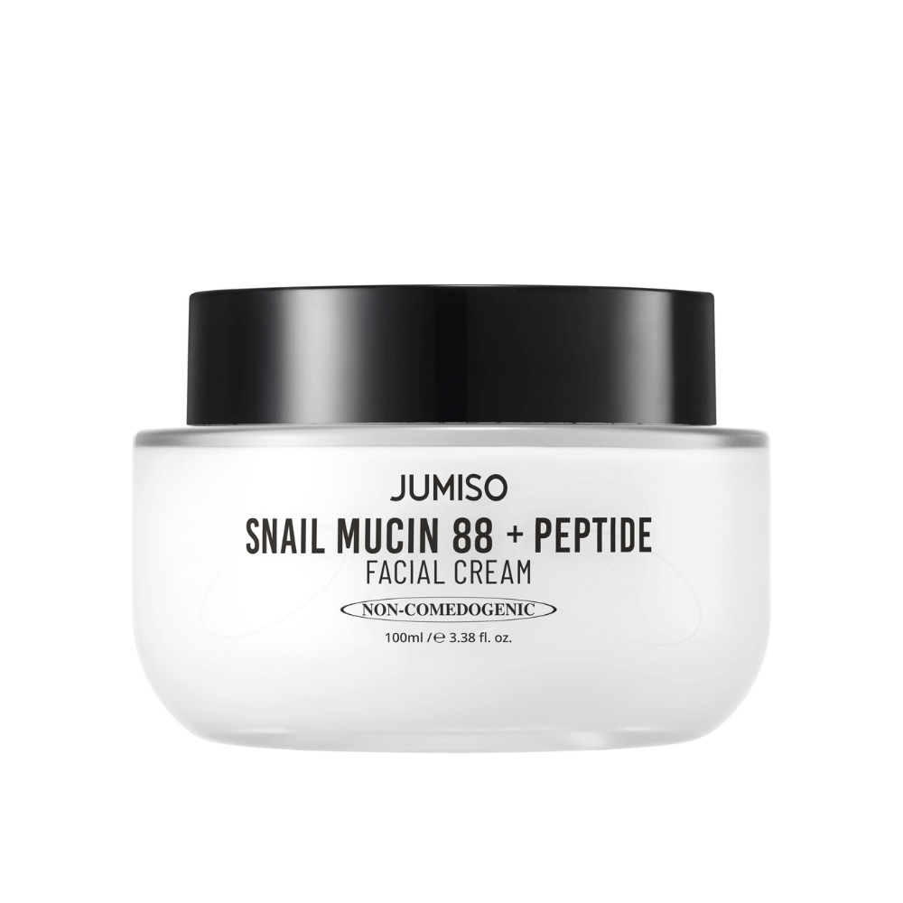 JUMISO Snail Mucin 88 + Peptide Facial Cream v beli posodi s črnim pokrovom. Krema za obraz z 88 % polžjega sekreta in peptidi za intenzivno nego kože in vlaženje.