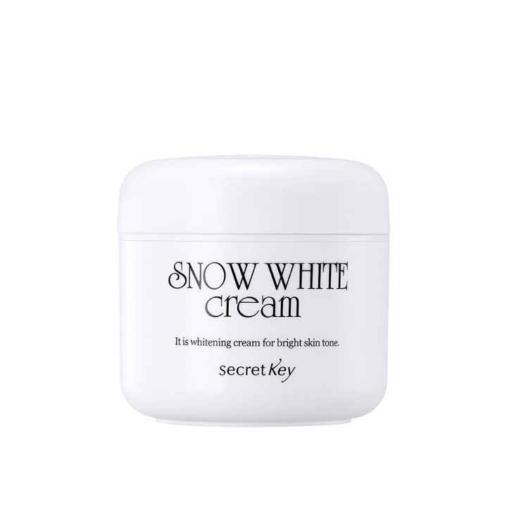 Slika izdelka Secret Key Snow White Cream v beli posodi s črnim besedilom na beli podlagi.