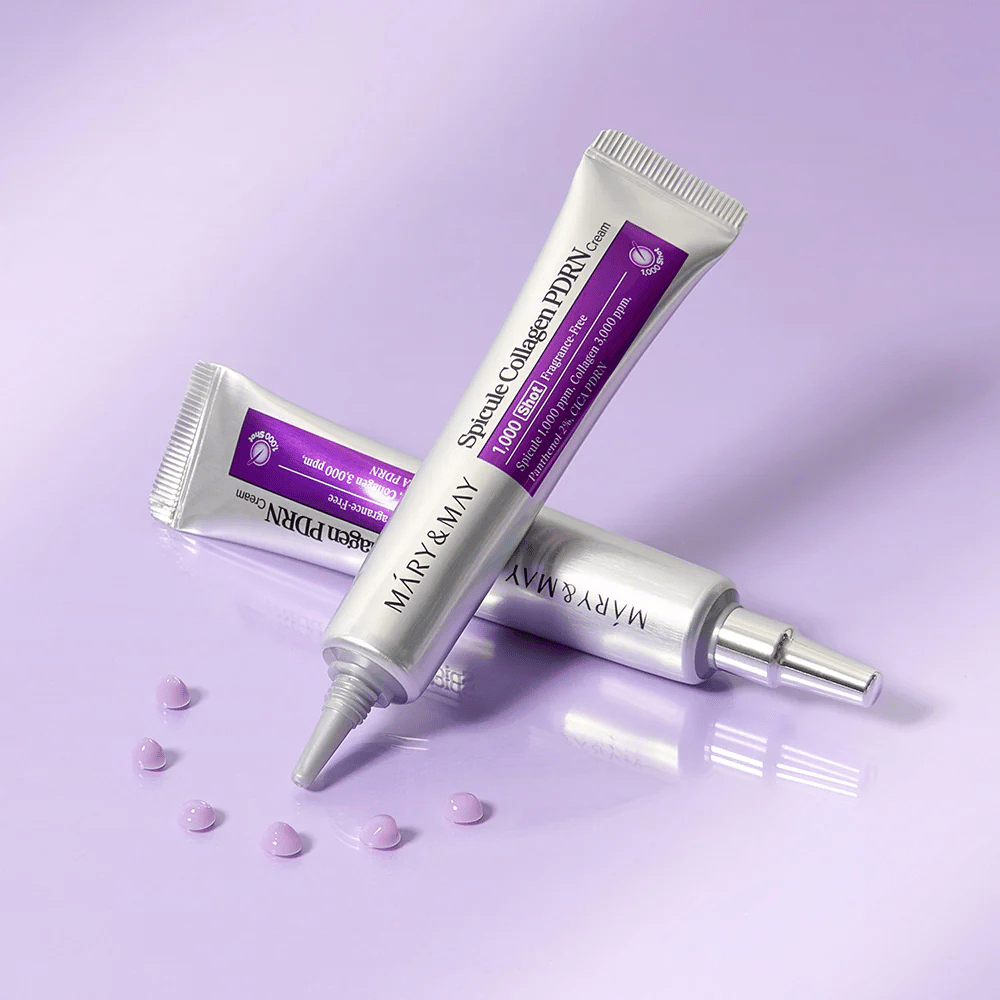 Mary & May Spicule Collagen PDRN Cream v več tubah na vijoličnem ozadju, intenzivno obnovitvena krema za obraz s tehnologijo spikul in kolagenom.