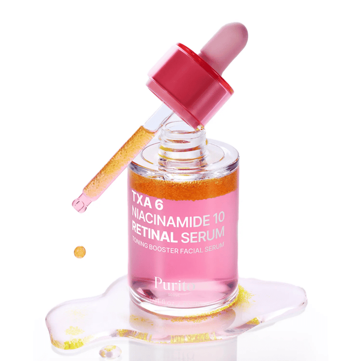 Purito TXA 6 Niacinamide 10 Retinal Serum – roza tonirajoči booster serum s pipeto. Združuje TXA, niacinamid in retinal za enakomeren ten kože.