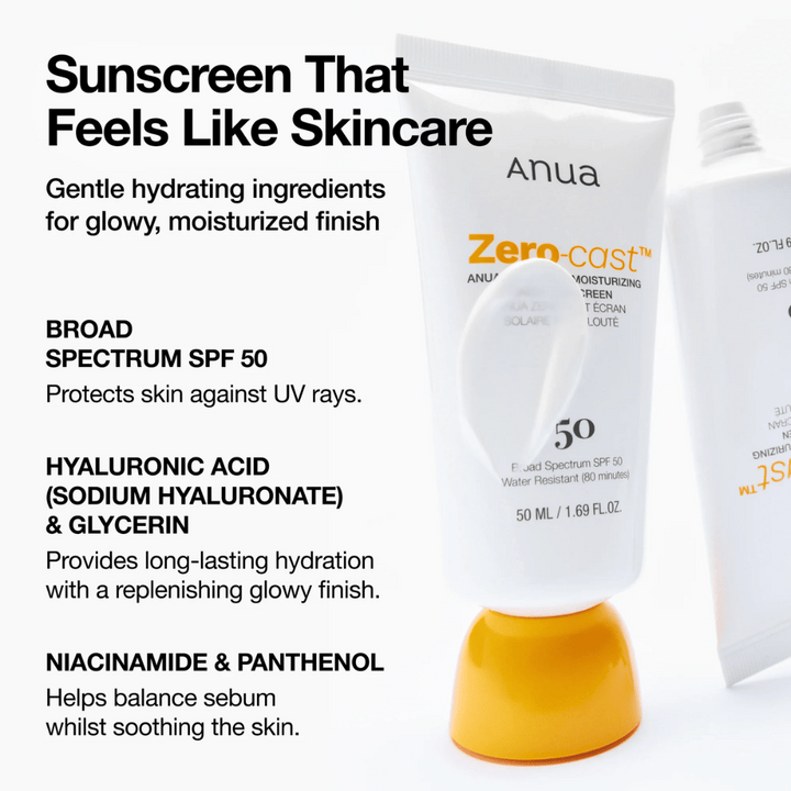Povečana slika ANUA Zero-Cast Moisturizing Sunscreen z SPF 50 - sončna krema v beli tubi z oranžnim pokrovčkom, prikazuje besedilo o sestavinah kot so hialuronska kislina, niacinamid in pantenol za navlaženo, zaščiteno kožo.