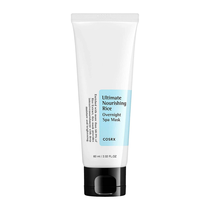 Ena tuba Ultimate Nourishing Rice Overnight Spa Mask 60ml iz COSRX na beli podlagi, zasnovana za posvetlitev kože.
